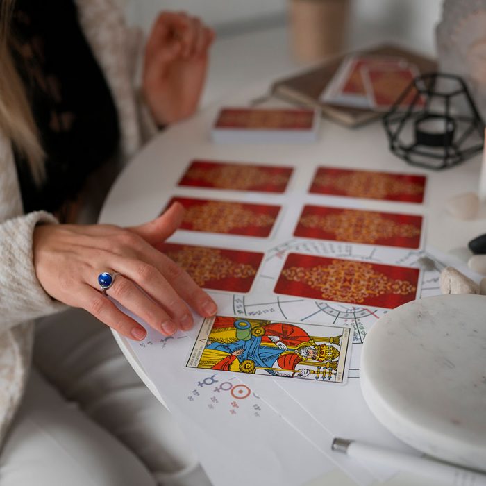 high-angle-woman-reading-tarot-home (1)